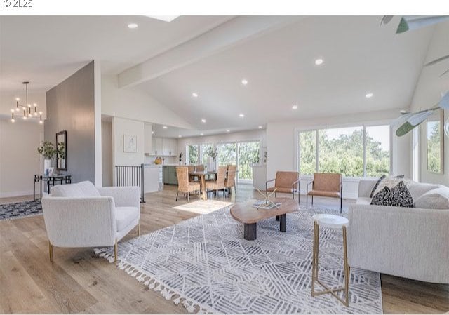 living area featuring recessed lighting, a chandelier, vaulted ceiling with beams, and light wood finished floors