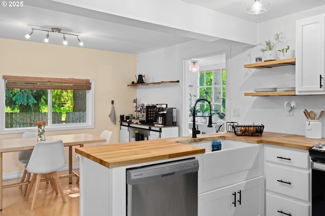 kitchen featuring a sink, open shelves, butcher block countertops, and dishwasher
