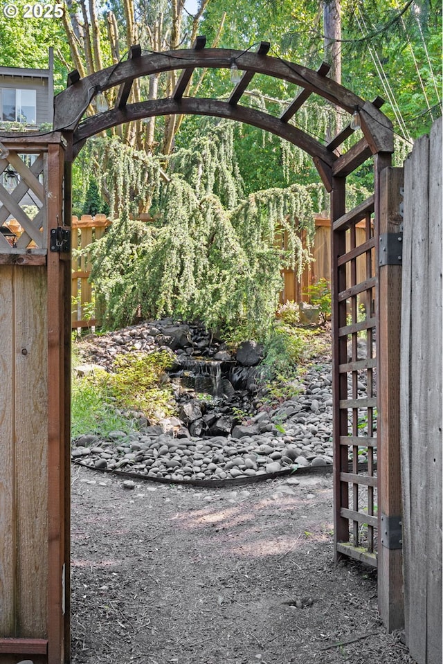 view of gate with fence