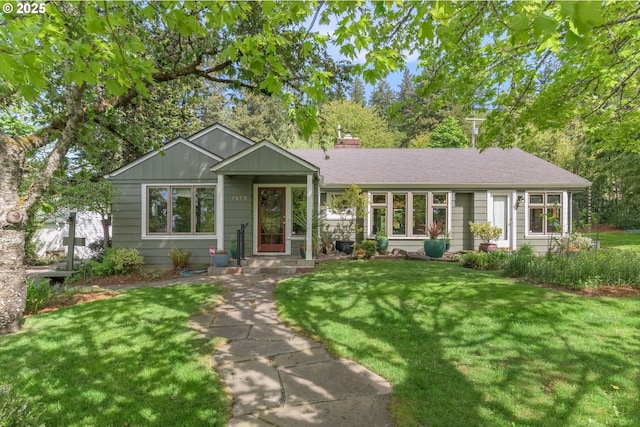 ranch-style home with a front lawn and a chimney