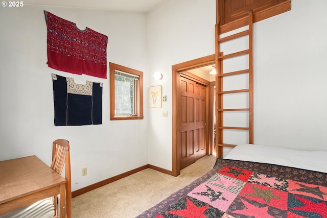 carpeted bedroom with baseboards