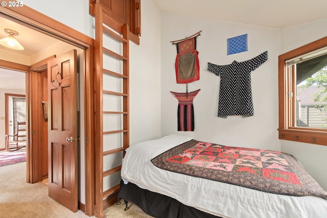 carpeted bedroom with vaulted ceiling