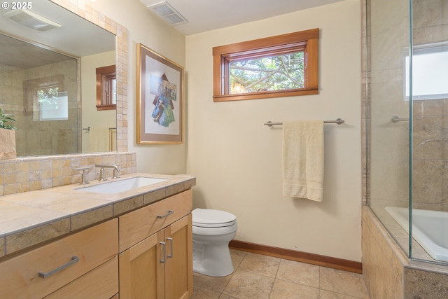 bathroom with baseboards, vanity, toilet, and visible vents