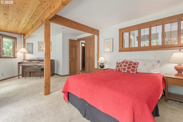 bedroom featuring carpet flooring and baseboards
