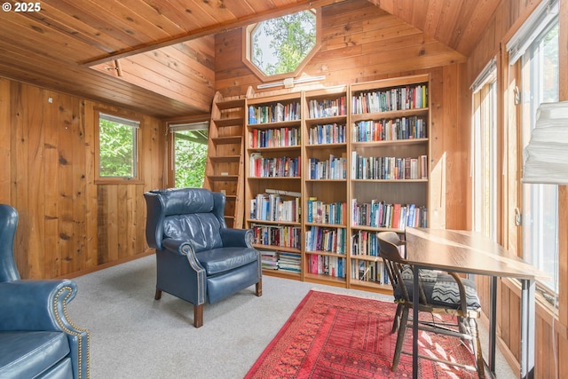 living area featuring wooden walls, vaulted ceiling, carpet floors, and wood ceiling