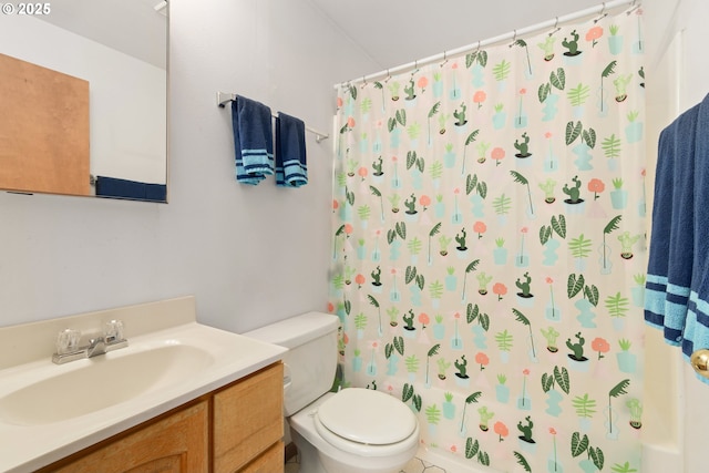 bathroom with toilet, curtained shower, and vanity