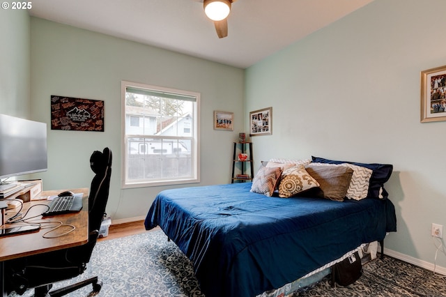 bedroom featuring hardwood / wood-style flooring and ceiling fan