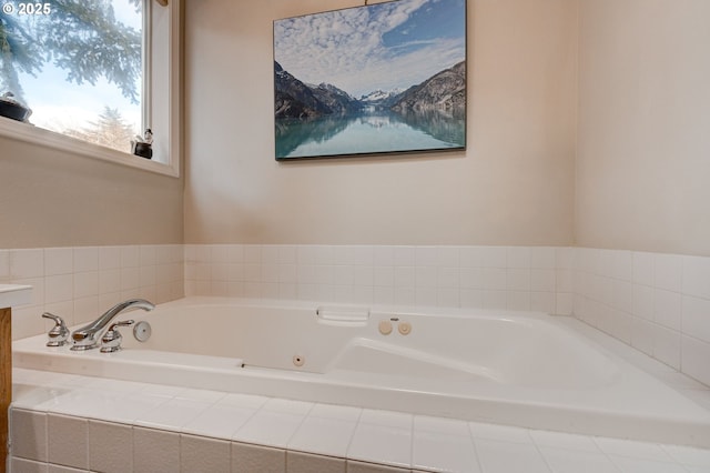 bathroom featuring tiled tub