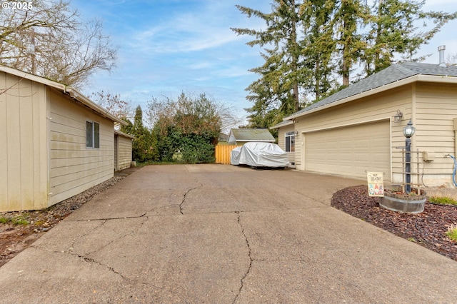 view of side of home with a garage