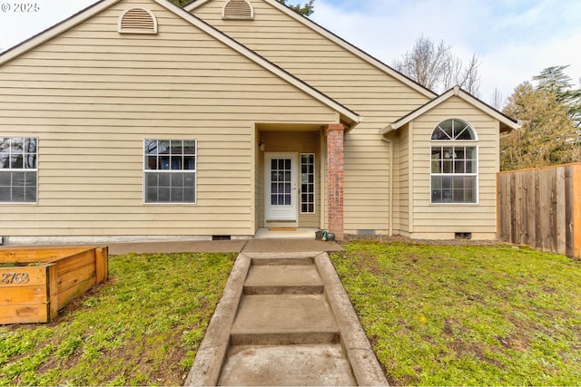 bungalow-style home with a front yard