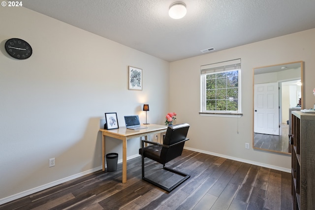 office space with dark hardwood / wood-style floors and a textured ceiling