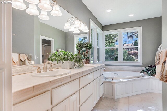 5632 Mac Way, Silverton, OR 97381 - full bathroom with tile patterned floors, a stall shower, double vanity, a garden tub, and recessed lighting