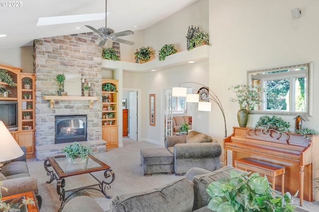 5632 Mac Way, Silverton, OR 97381 - living room with light colored carpet, a ceiling fan, a fireplace, and high vaulted ceiling