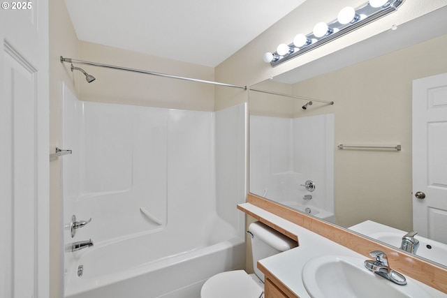 full bath featuring toilet, bathtub / shower combination, and vanity