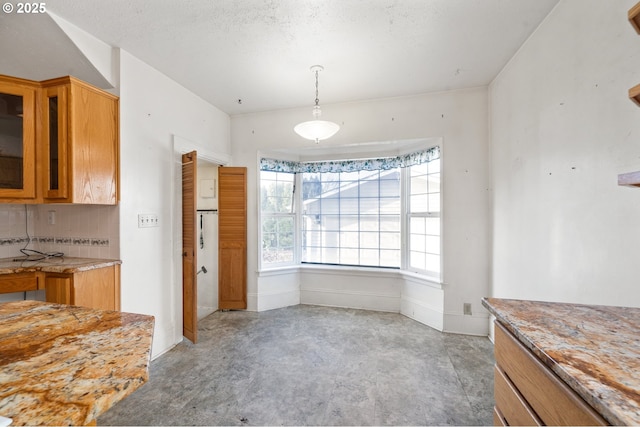 dining area featuring a textured ceiling