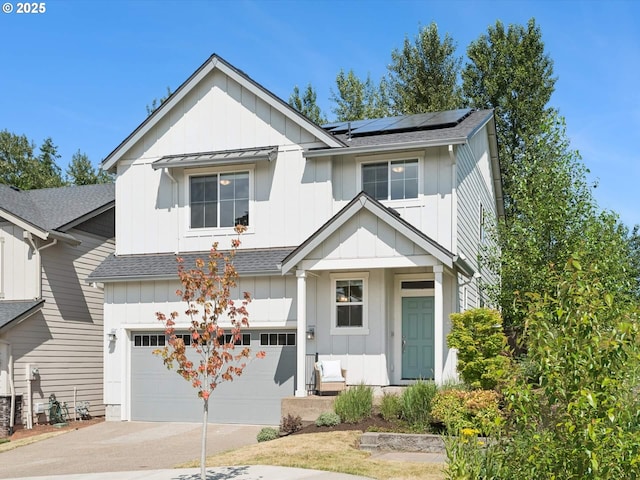 11179 SE Honorable Way, Happy Valley, OR 97086 - view of front of home featuring board and batten siding, a shingled roof, driveway, and roof mounted solar panels