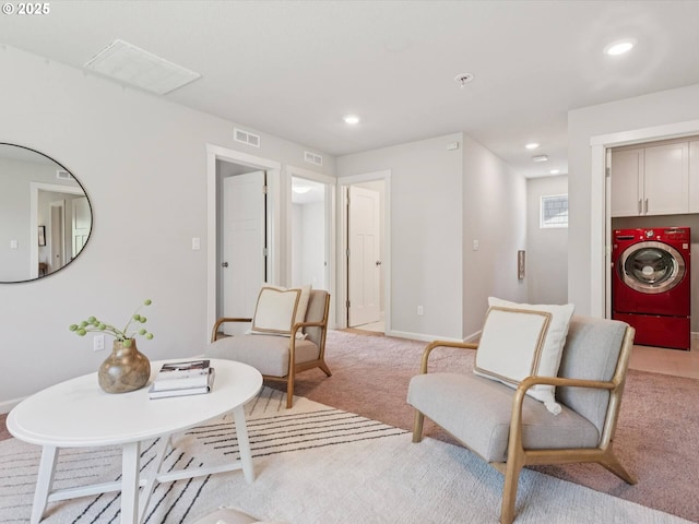 11179 SE Honorable Way, Happy Valley, OR 97086 - living room with washer / clothes dryer, light colored carpet, and recessed lighting