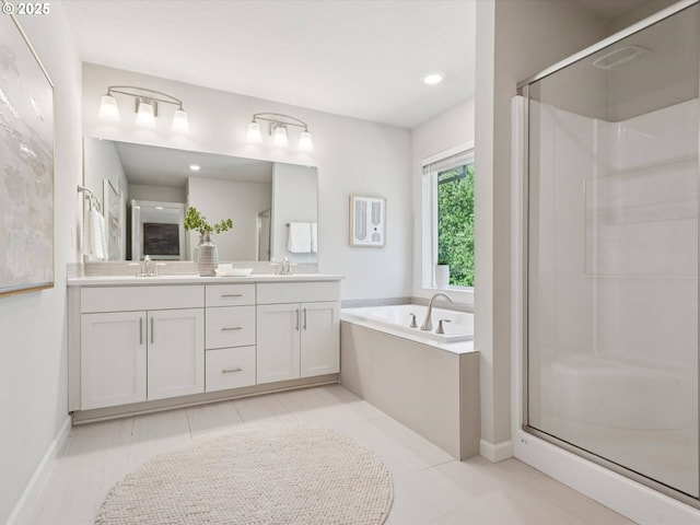 11179 SE Honorable Way, Happy Valley, OR 97086 - full bathroom with double vanity, a garden tub, a shower stall, and tile patterned floors