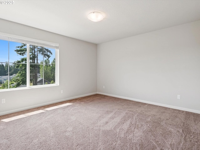 11179 SE Honorable Way, Happy Valley, OR 97086 - carpeted spare room featuring baseboards