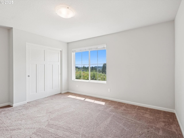 11179 SE Honorable Way, Happy Valley, OR 97086 - unfurnished bedroom featuring carpet and a closet