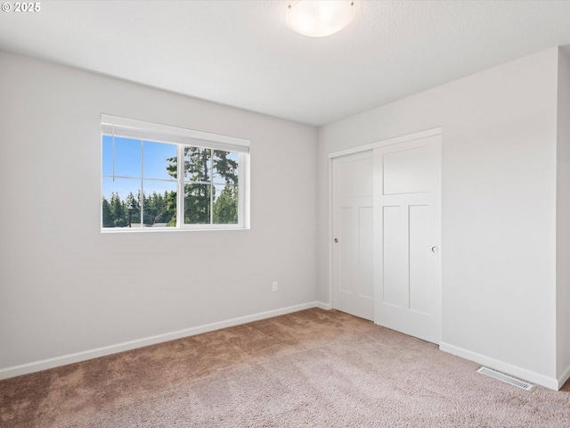 11179 SE Honorable Way, Happy Valley, OR 97086 - unfurnished bedroom with carpet flooring and a closet