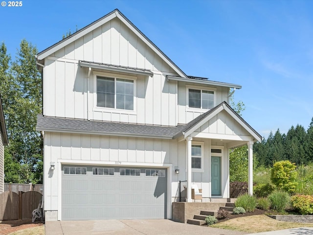 11179 SE Honorable Way, Happy Valley, OR 97086 - view of front of home with a shingled roof, board and batten siding, an attached garage, and concrete driveway