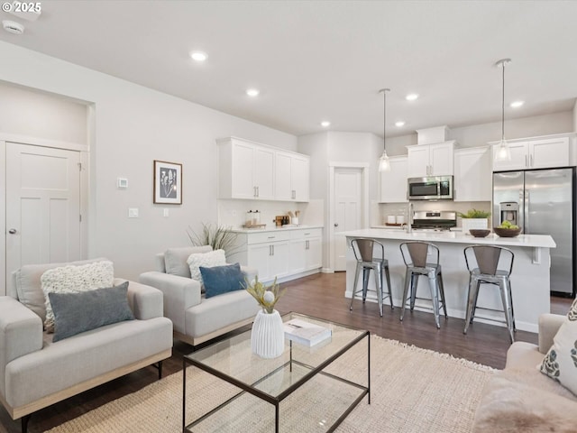 11179 SE Honorable Way, Happy Valley, OR 97086 - living room with dark wood-style flooring and recessed lighting