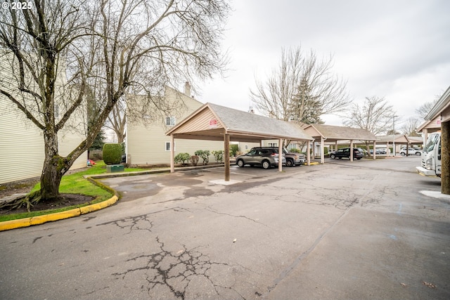 view of parking / parking lot with a carport