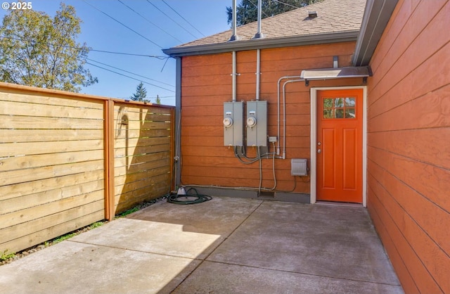 3552 NE Killingsworth St, Portland, OR 97211 - property entrance with roof with shingles and a patio