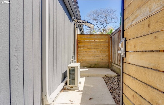 view of side of property featuring ac unit