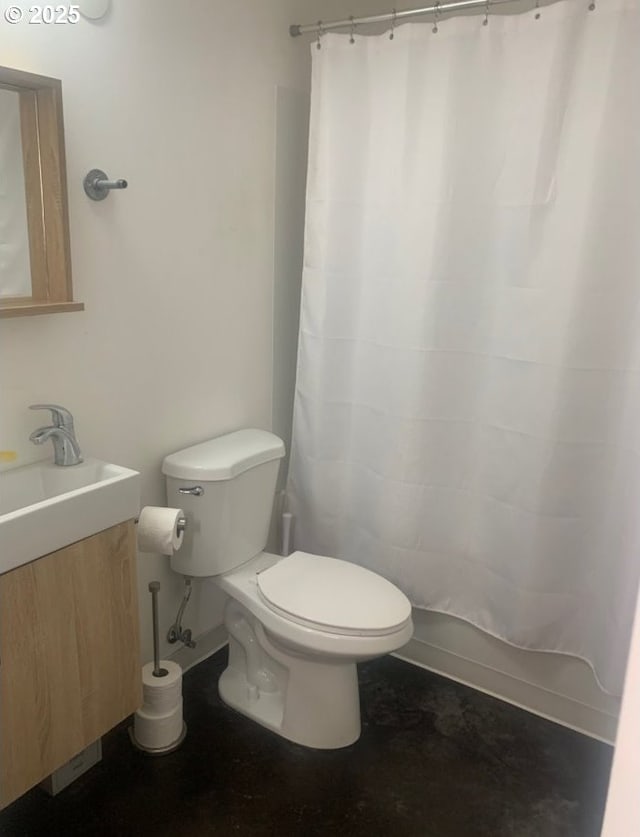 bathroom featuring toilet, a shower with curtain, and vanity