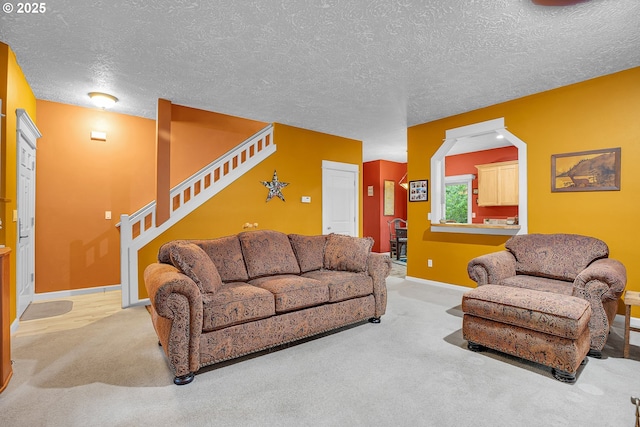 1259 SE Stapleton Loop, Gresham, OR 97080 - living area with carpet flooring, stairway, baseboards, and a textured ceiling