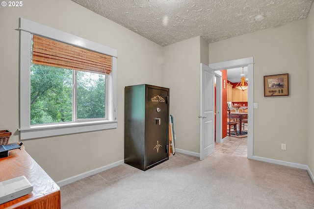 1259 SE Stapleton Loop, Gresham, OR 97080 - office area featuring a textured ceiling, carpet floors, and baseboards