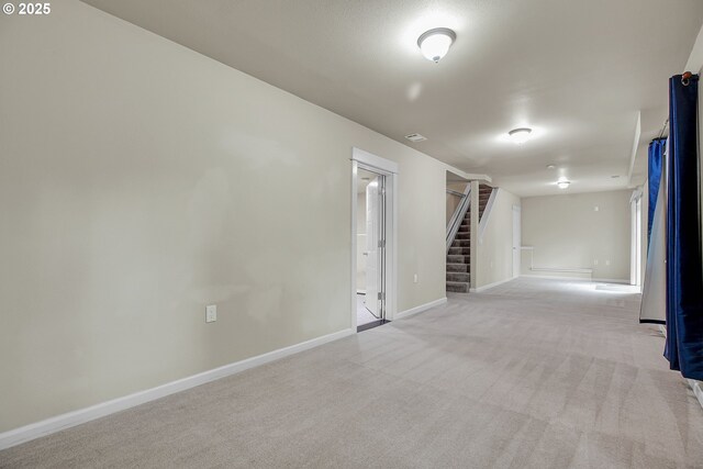 1259 SE Stapleton Loop, Gresham, OR 97080 - empty room with stairway, light carpet, and baseboards