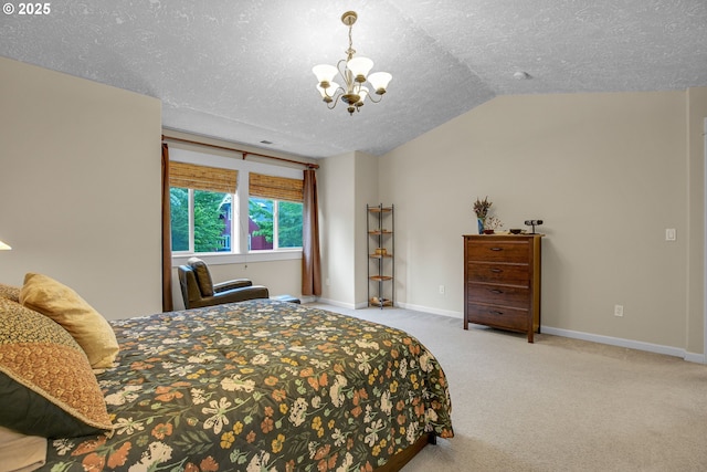 1259 SE Stapleton Loop, Gresham, OR 97080 - bedroom with a chandelier, lofted ceiling, carpet floors, a textured ceiling, and baseboards
