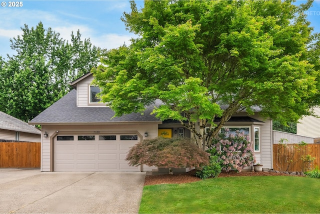 7100 SW 164th Ter, Beaverton, OR 97007 - view of property hidden behind natural elements featuring concrete driveway, roof with shingles, and an attached garage