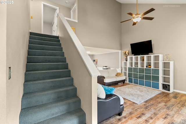 7100 SW 164th Ter, Beaverton, OR 97007 - stairway with wood finished floors, ceiling fan, high vaulted ceiling, and baseboards