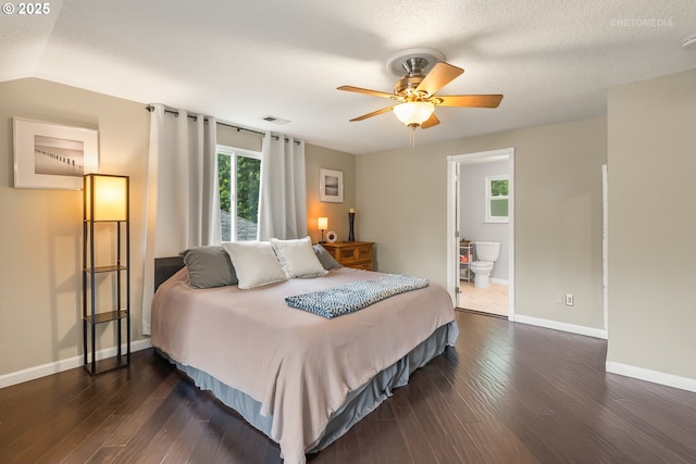 7100 SW 164th Ter, Beaverton, OR 97007 - bedroom with dark wood-style floors, baseboards, ensuite bath, and a ceiling fan