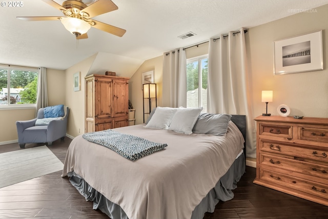 7100 SW 164th Ter, Beaverton, OR 97007 - bedroom with dark wood-style flooring, multiple windows, baseboards, and lofted ceiling