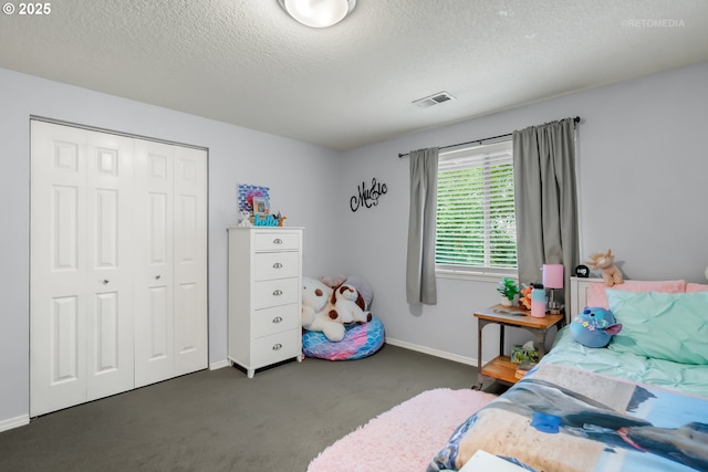 7100 SW 164th Ter, Beaverton, OR 97007 - bedroom with carpet flooring, baseboards, a closet, and a textured ceiling