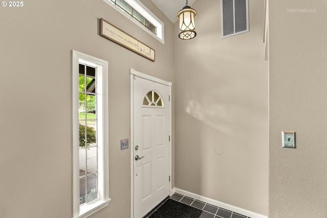 7100 SW 164th Ter, Beaverton, OR 97007 - entrance foyer featuring dark tile patterned floors and baseboards