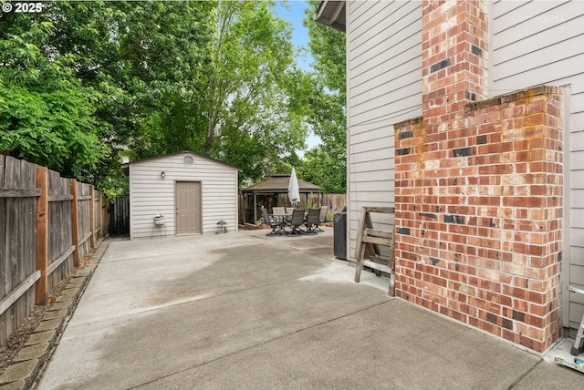 7100 SW 164th Ter, Beaverton, OR 97007 - fenced backyard featuring outdoor dining space, a patio, and a gazebo