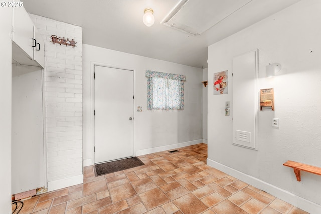 154 W Hickory St, Roseburg, OR 97471 - foyer featuring baseboards and light stone finish floors