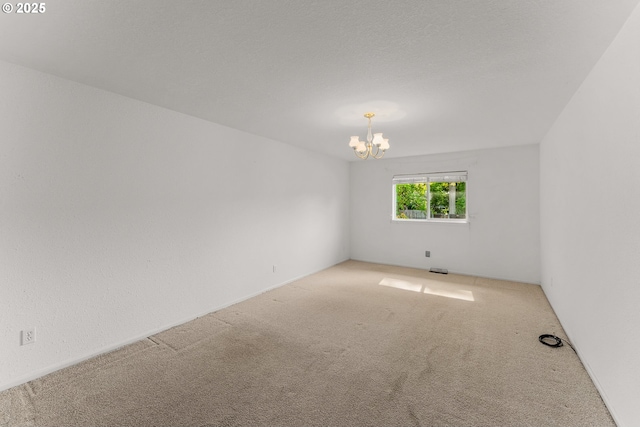 154 W Hickory St, Roseburg, OR 97471 - spare room with carpet and a chandelier