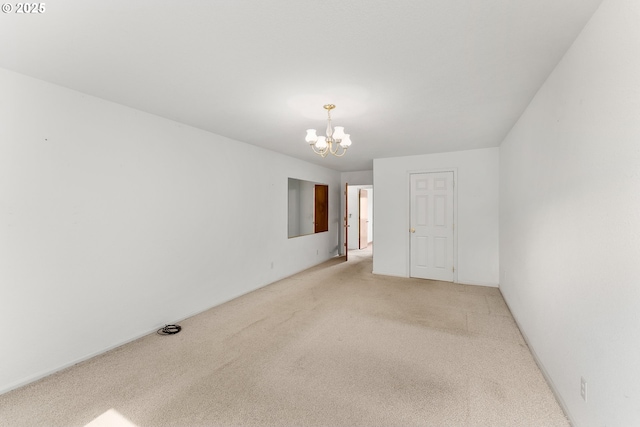 154 W Hickory St, Roseburg, OR 97471 - unfurnished room featuring light carpet and a chandelier