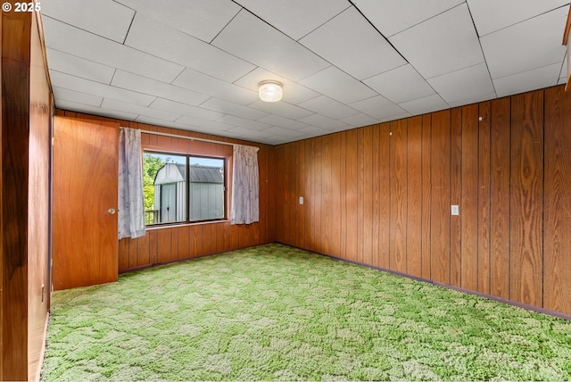 154 W Hickory St, Roseburg, OR 97471 - carpeted empty room with wood walls
