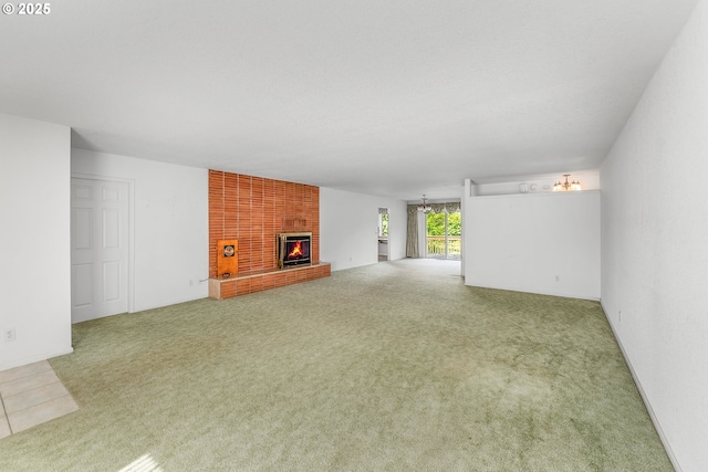 154 W Hickory St, Roseburg, OR 97471 - unfurnished living room with carpet and a brick fireplace