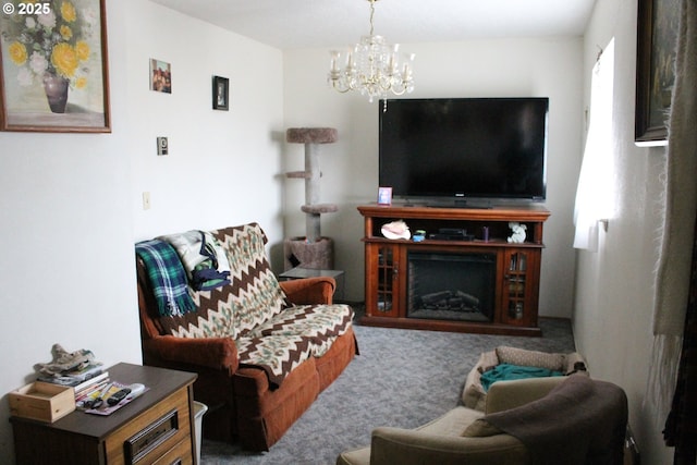 carpeted living area featuring a fireplace and an inviting chandelier