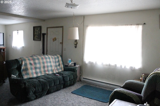 living room with a baseboard heating unit, a textured ceiling, and carpet flooring