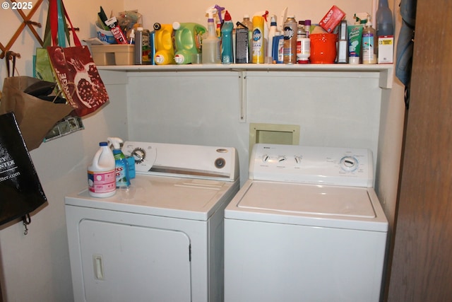 washroom with washing machine and clothes dryer